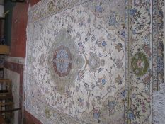 A Persian ivory ground rug 355 x 260cm