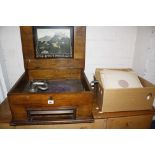 A walnut and marquetry cased polyphon and a quantity of records