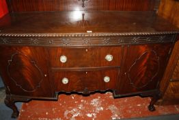 A reproduction mahogany bow front sideboard having carved gadroon decoration to the edge, carved