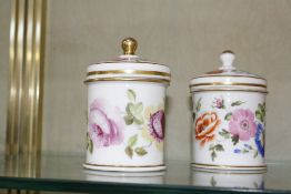 A pair of porcelain pots with covers, floral decorated, 10.5cm high, a Wade flower encrusted vase of