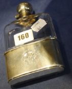 An Edwardian facetted glass hip flask with hinged silver stopper and mount, the silver Sheffield
