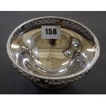 A silver pedestal bowl with pierced border by Mappin & Webb, Sheffield 1988, 5oz, 13cm in diameter