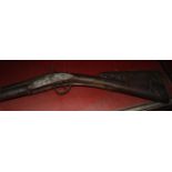 An 18ct Century Flintlock hunting gun, with elaborate filigree metal work of Aeolus, god of wind, to