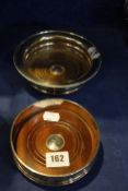 A bottle stand with gadrooned border, Birmingham 1929, 16cm in diameter and a 0.925 coaster from