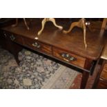 A George III mahogany side table with three drawers 152cm wide