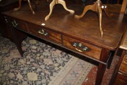 A George III mahogany side table with three drawers 152cm wide