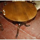 A George III oak tripod table 77cm diameter