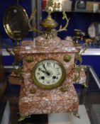 A gilt metal and pink veined marble clock garniture, the clock with eight day movement striking on a