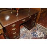 An early 19th century mahogany kneehole desk. 137cm wide x 66cm deep x 82cm high. Best Bid