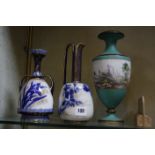 A Royal Doulton two-handled vase, a Doulton Burslem ewer and a porcelain vase depicting a mountain