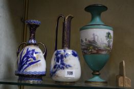 A Royal Doulton two-handled vase, a Doulton Burslem ewer and a porcelain vase depicting a mountain