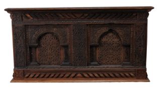A carved oak wall panel, 17th century and later elements, profusely carved throughout, with two