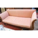 An early Victorian mahogany settee with scrolled arms on reeded feet 215cm length