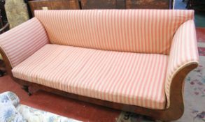 An early Victorian mahogany settee with scrolled arms on reeded feet 215cm length