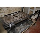 A cast iron fire back in 16th century style and a cast iron dog grate
