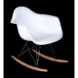 After Charles and Ray Eames, an RAR style rocking armchair, originally designed in 1950, in