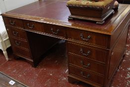 A George II style mahogany pedestal desk with nine drawers 155cm wide
