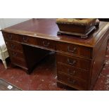 A George II style mahogany pedestal desk with nine drawers 155cm wide