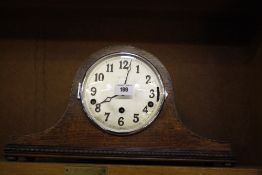 Two oak cased mantel clocks and a walnut cased Art Deco design mantel clock. (all working and