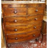 A 19th Century bowfront chest of two short and three long drawers on turned feet 107cm wide