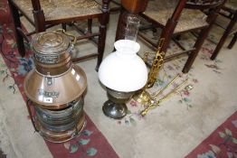 A brass and copper ships lantern Player & Mitchell, Birmingham, together with an oil lamp and fire