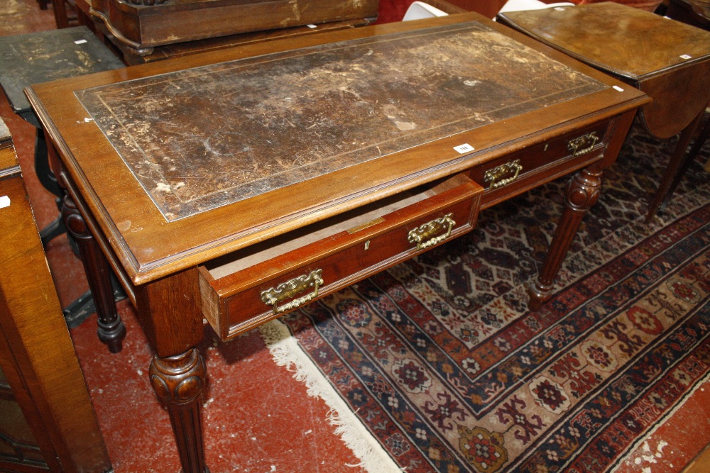 A Victorian mahogany writing desk, with an inset writing surface, both drawers bearing stamp J.A