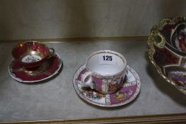 A Dresden cabinet cup and saucer, a cabinet cup and saucer with beehive mark, a Minton cabinet cup