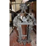 A black painted wrought-iron lantern in the Continental 18th century style