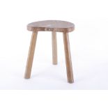 A Mouseman oak three legged stool