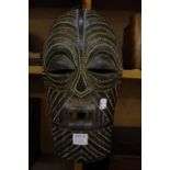 A carved African wooden head, 39cm high and a mask -2