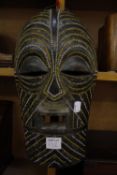 A carved African wooden head, 39cm high and a mask -2