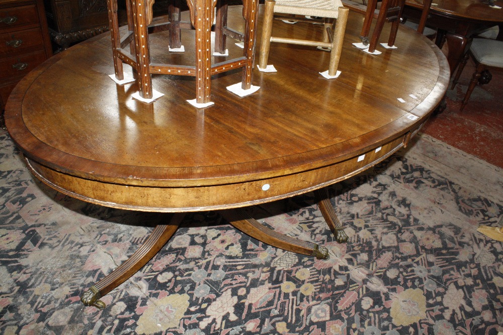 A mahogany oval twin pillar dining table, 20th Century 185cm extended Best Bid