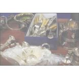 A large quantity of silverplated tableware including candelabra, goblets, tureens, tankards, wine