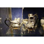 A Walker & Hall plated four piece tea set, a Dutch lidded canister, a Shakespeare jug, a glass