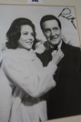 A framed/ mounted black and white photo signed by Patrick MacNee, a black and white signed photo