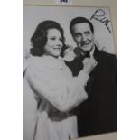 A framed/ mounted black and white photo signed by Patrick MacNee, a black and white signed photo