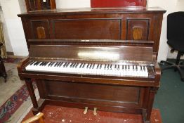 A Boosey and Co upright piano and piano stool