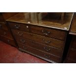 An Edwardian mahogany chest, the rectangular moulded top above two short and three boxwood lined