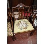 A George III mahogany open armchair, the slightly arched top rail above a pierced vase shaped