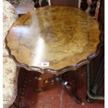 A wall shelf with a low Victorian nursery chair with barley turned legs and a small walnut table