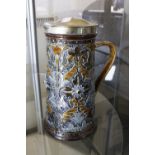 A Doulton stoneware silver-plate mounted jug by Florence Barlow, 24cm high