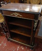 A Victorian amboyna and ebonised gilt metal mounted open bookcase 74cm wide