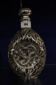 A Chinese clear glass and silver mounted decanter, decorated with dragon, marked Tientsin Yechig