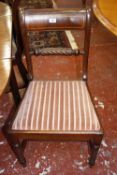 A set of four early 19th century mahogany dining chairs