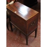 An early 19th mahogany and inlaid cellarette on square tapering legs