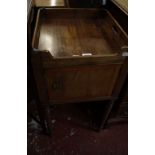 A Victorian mahogany pot cupboard, the square galleried top above a crossbanded door on ring