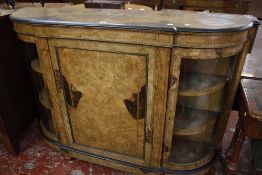 A Victorian burr walnut, ebonised and inlaid bowfront credenza with a central cupboard flanked by