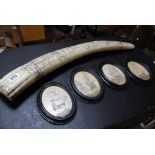 Four resin "Scrimshaw" oval plaques of sailing ships and a resin "Scrimshaw" whale tooth.