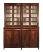 A French solid walnut and glazed display cabinet, first half 19th century  A French solid walnut and