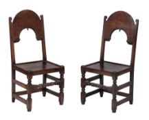 A pair of Charles II oak backstools , circa 1660, probably Derbyshire  A pair of Charles II oak